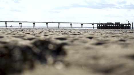 beautiful shot of the pier in the daytime with a view of an amazing beach