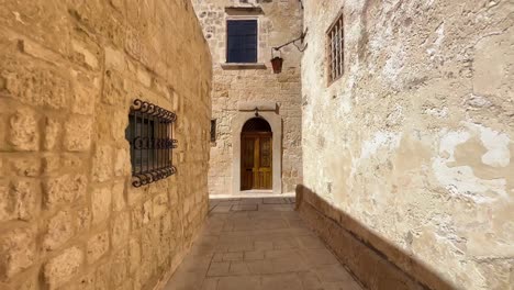 4k gimbal of the narrow and old streets of mdina, malta's historic old capital, a unesco heritage site with baroque architecture, rich history, and enchanting surroundings