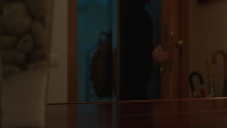 person entering a room at night