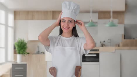 happy indian female professional chef getting ready for cooking