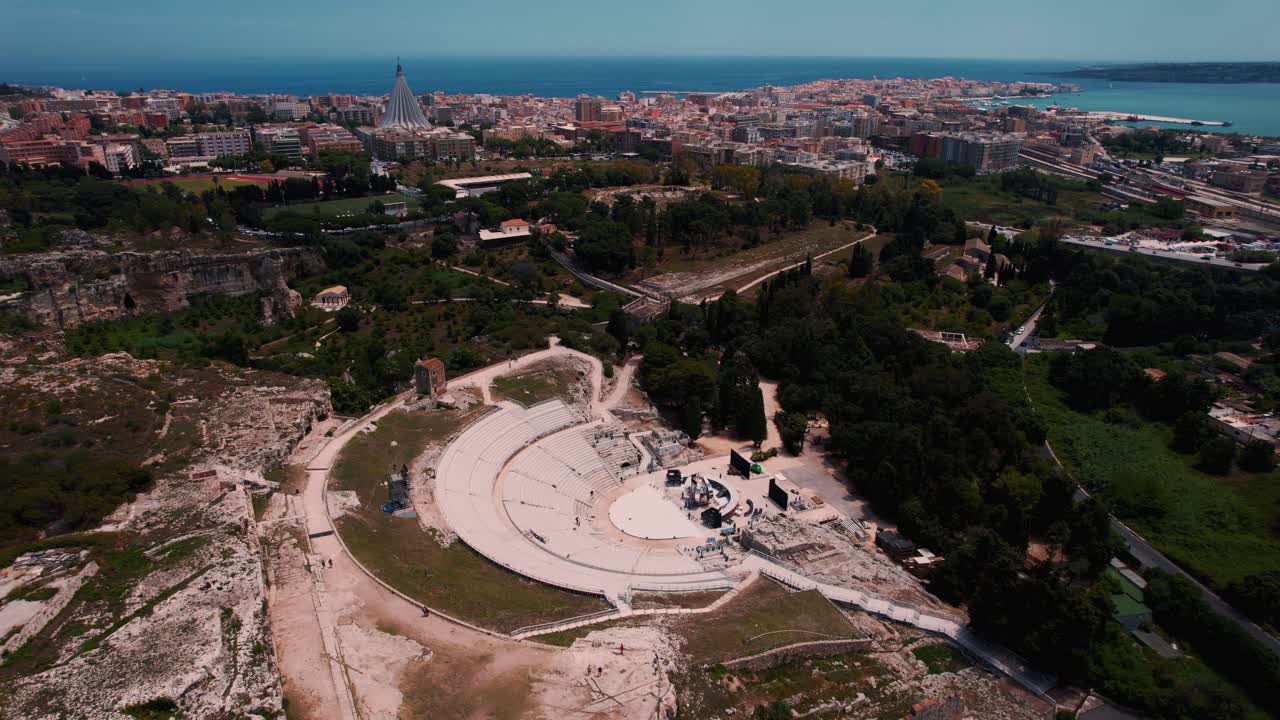Drone footage of ancient Roman ruins and amphitheater in Siracusa archaeological park. Sicily, Italy
