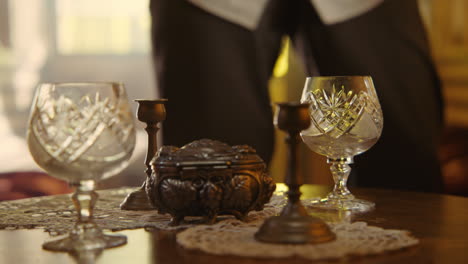 antique table setting with crystal glasses and candlesticks