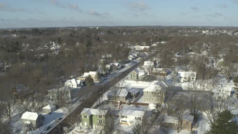 aerial, suburban community blanketed in snow in north america