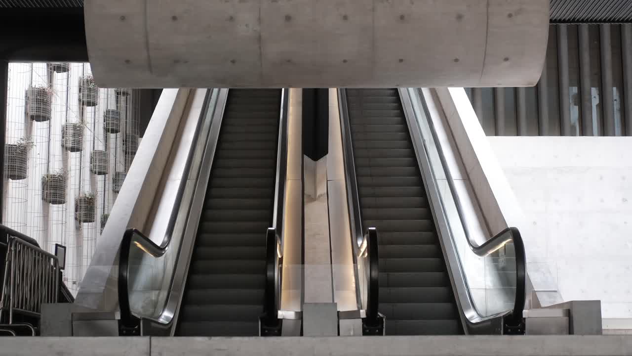 COVID and quarantine vibe for Empty Hall with escalator and concrete structures shot in 4k