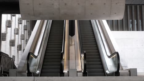 covid and quarantine vibe for empty hall with escalator and concrete structures shot in 4k