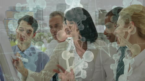 collaborating in office, business team viewing molecular structure animation overlay