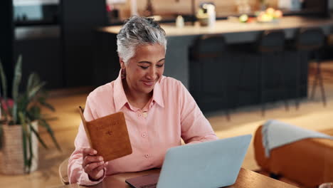 woman planning travel with passport and laptop
