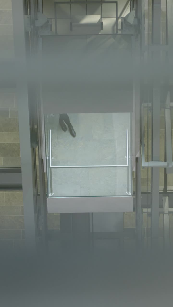 Vertical view of elevator in Frankfurt building, modern and sleek feel