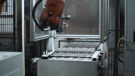 Robotic-manipulator-taking-metal-detail-on-factory.-Automatical-assembling-line