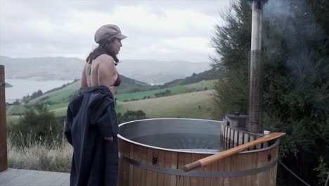 woman relaxing in outdoor hot tub