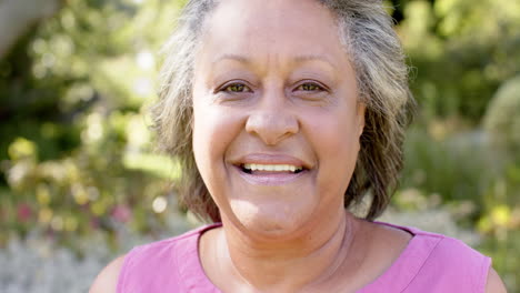 a senior biracial woman with light brown skin is laughing