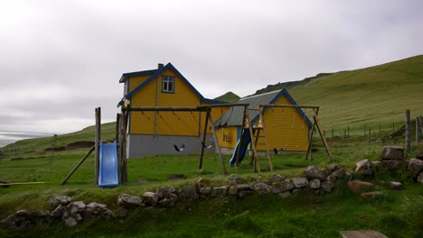 yellow houses buildings in mykines, faroe islands