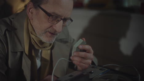 The Spy Listens to Discreet Recordings
