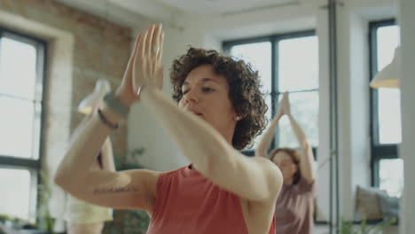 yoga teacher giving group class
