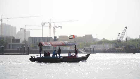 Water-taxi-driving-down-Dubai-Creek