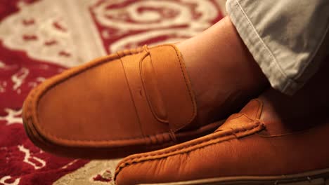 brown loafers on feet