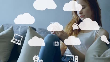 Animation-of-clouds-and-media-icons-over-woman-using-smartphone