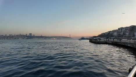 sunset over the bosphorus strait with istanbul cityscape and bridge