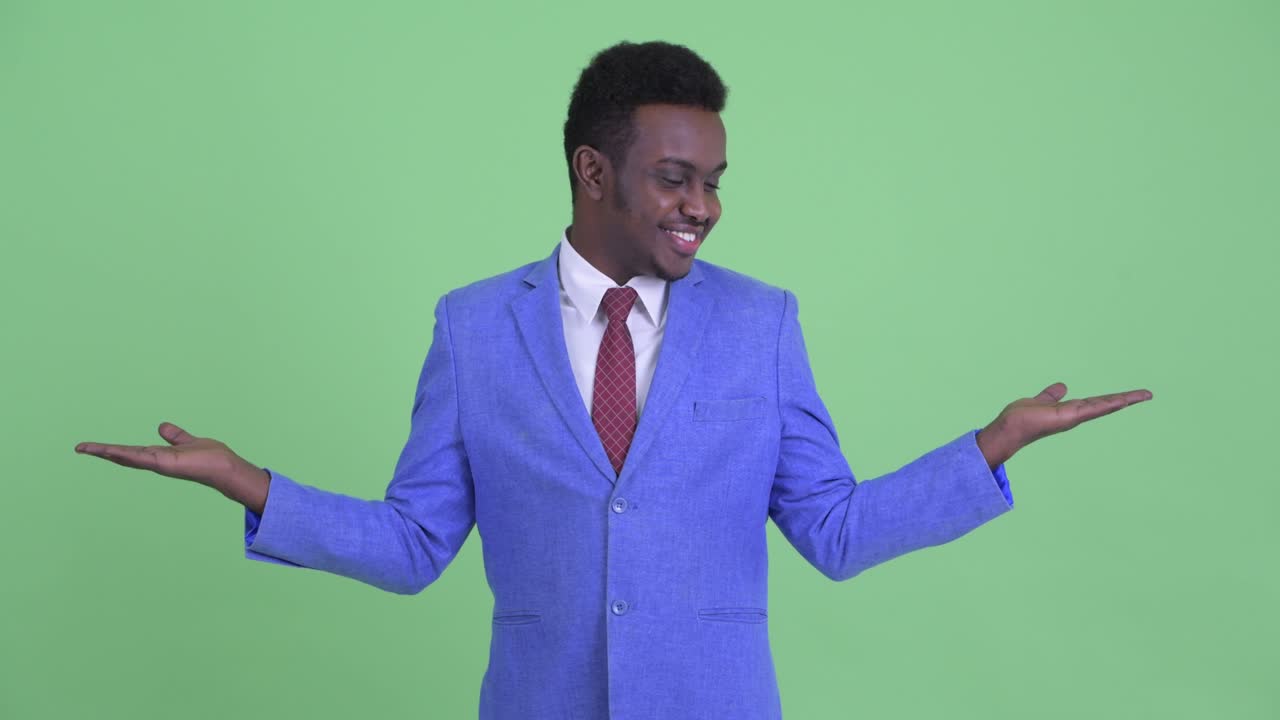 Young African businessman with Afro hair in suit