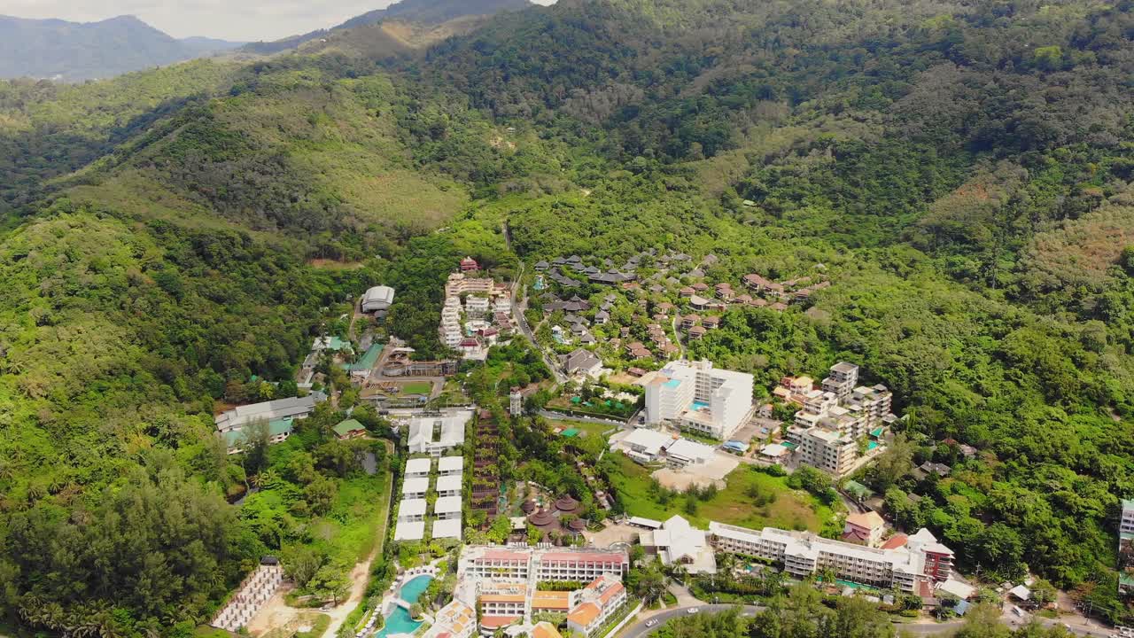 Aerial view of island resort nestled between mountains on Phuket, Thailand