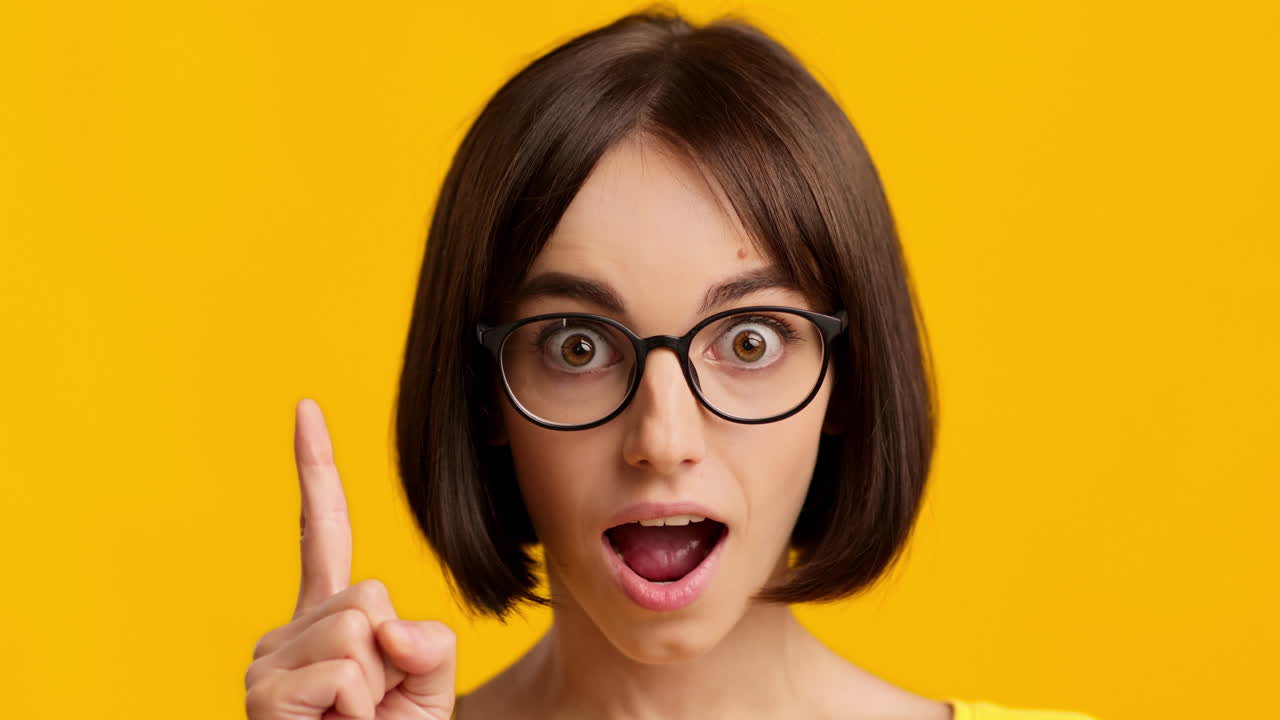Woman with Glasses Pointing Up