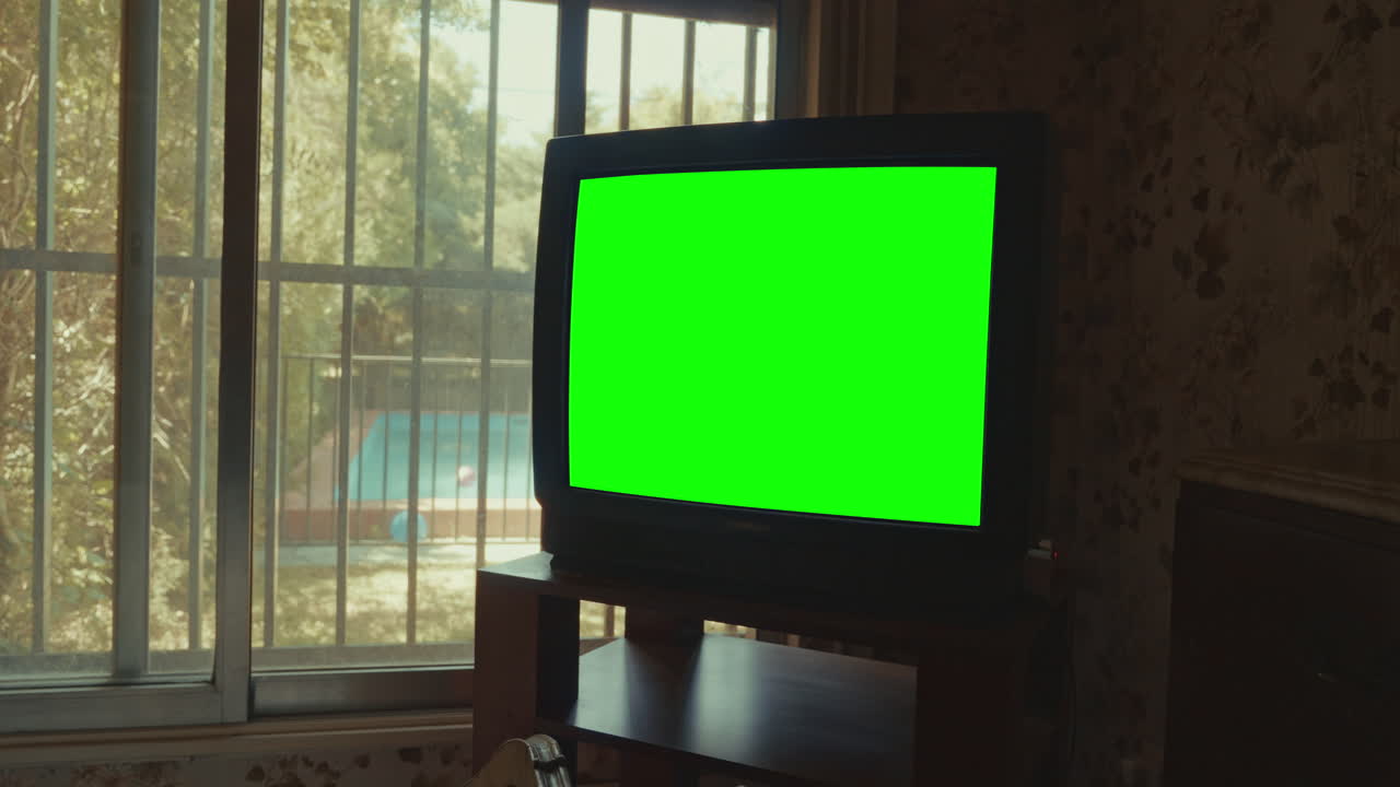 Vintage CRT Television with Green Screen in a Retro Room