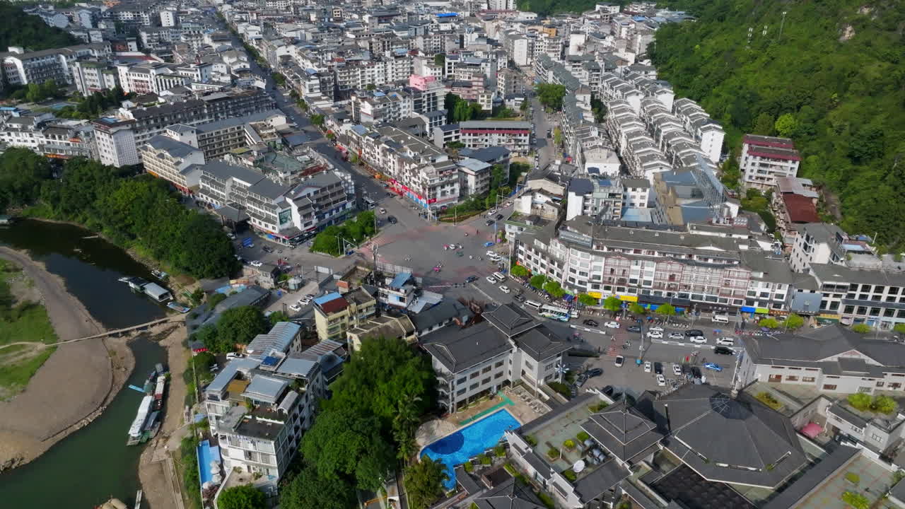 Aerial view around of traffic at a jntersection in Yangshuo, summer in China