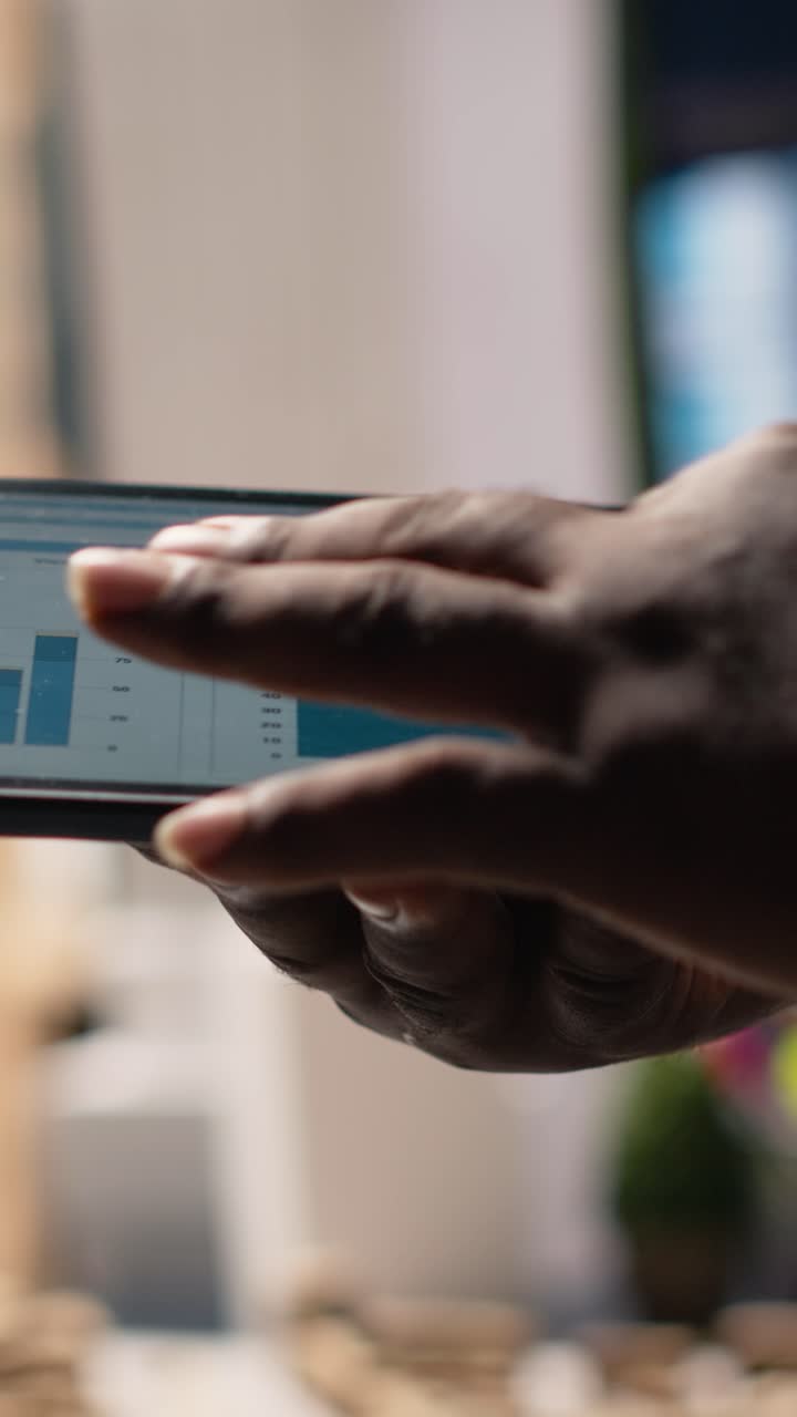 Vertical Video Close up of black professional uses architectural software on tablet