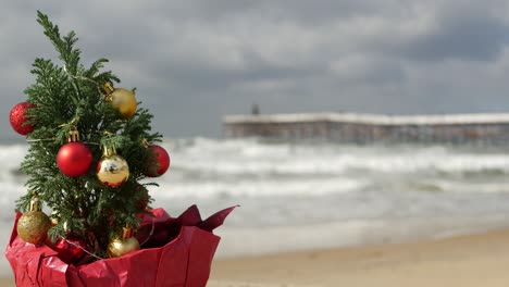 christmas tree on sandy sea beach, new year on ocean coast, xmas in california.