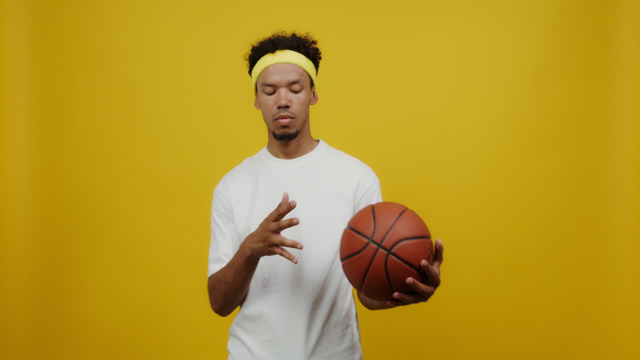 Man Holding a Basketball