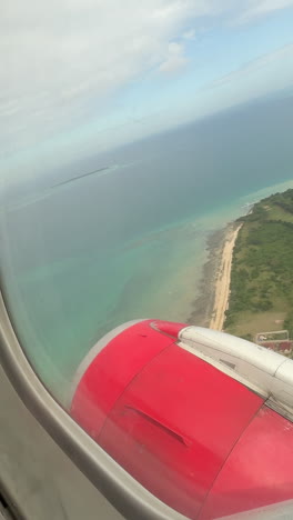 aerial view of a tropical island from an airplane window