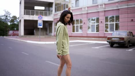 a young brunette girl runs up and rides a skateboard skillfully keeping her balance. hobby, leisure