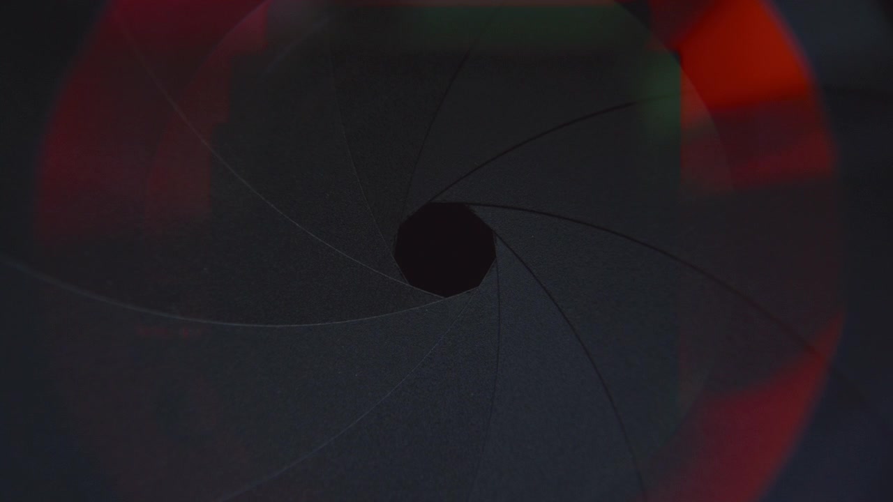Extreme Close Up of Aperture Blades Closing in Camera Lens