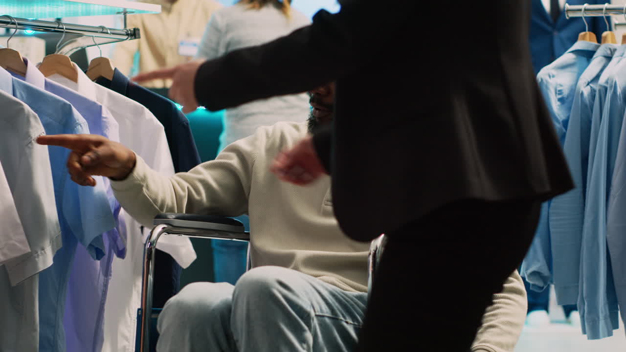 Man in Wheelchair Shopping in Clothing Store