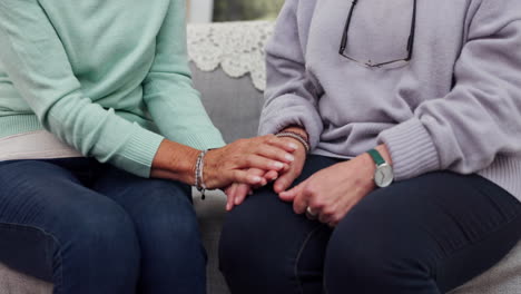 Senior-woman,-friends-and-holding-hands-in-care
