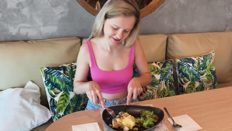 woman eating lunch in a restaurant