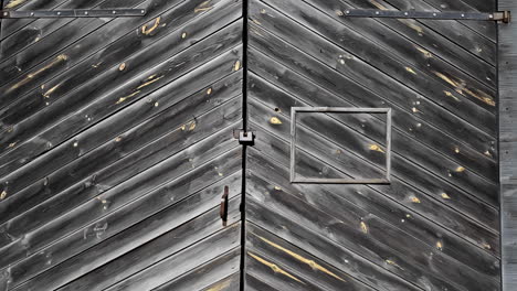 old, aged wooden door on an historic structure - push in