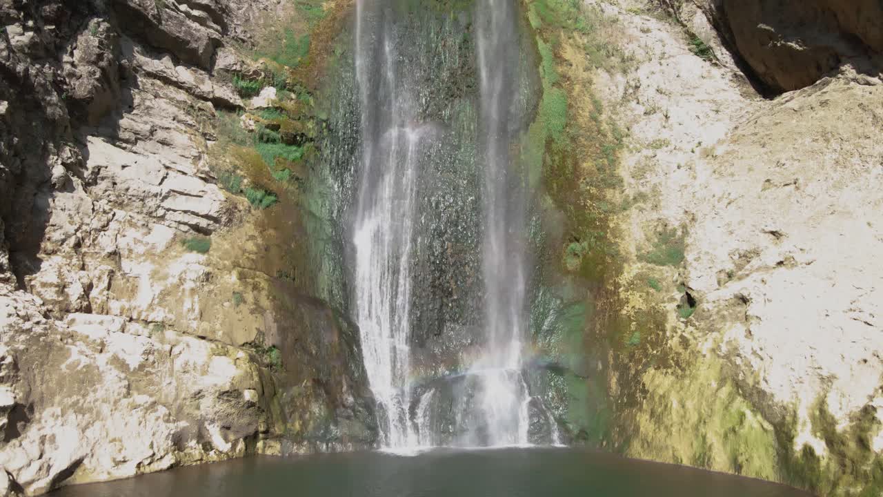 Stunning Waterfall Cascading Down Rocky Cliff
