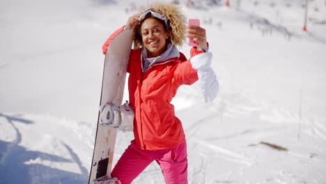 skier taking a self portrait with phone