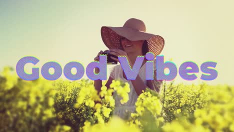 Animation-of-good-vibes-text-over-happy-woman-outdoors