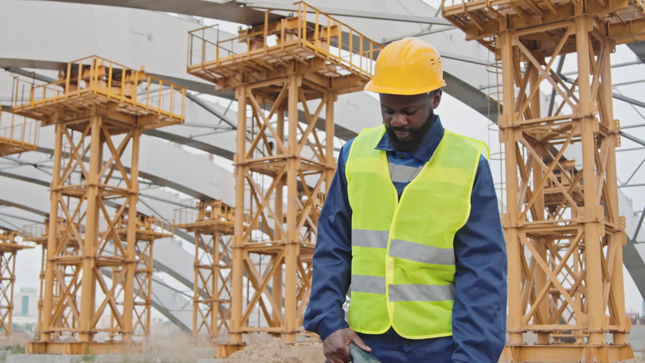 Portrait of Black Male Construction Worker with Jackhammer