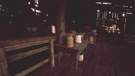 a rustic barn interior with milk jugs