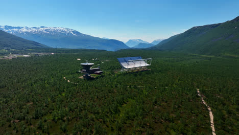 Drone-flying-toward-the-EISCAT-Troms-station,-sunny,-summer-day-in-Norway