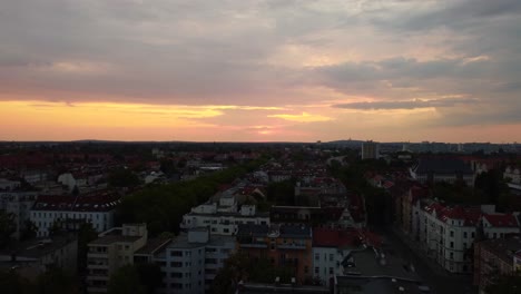 dramatic orange big sky clouds over the roofs of berlin