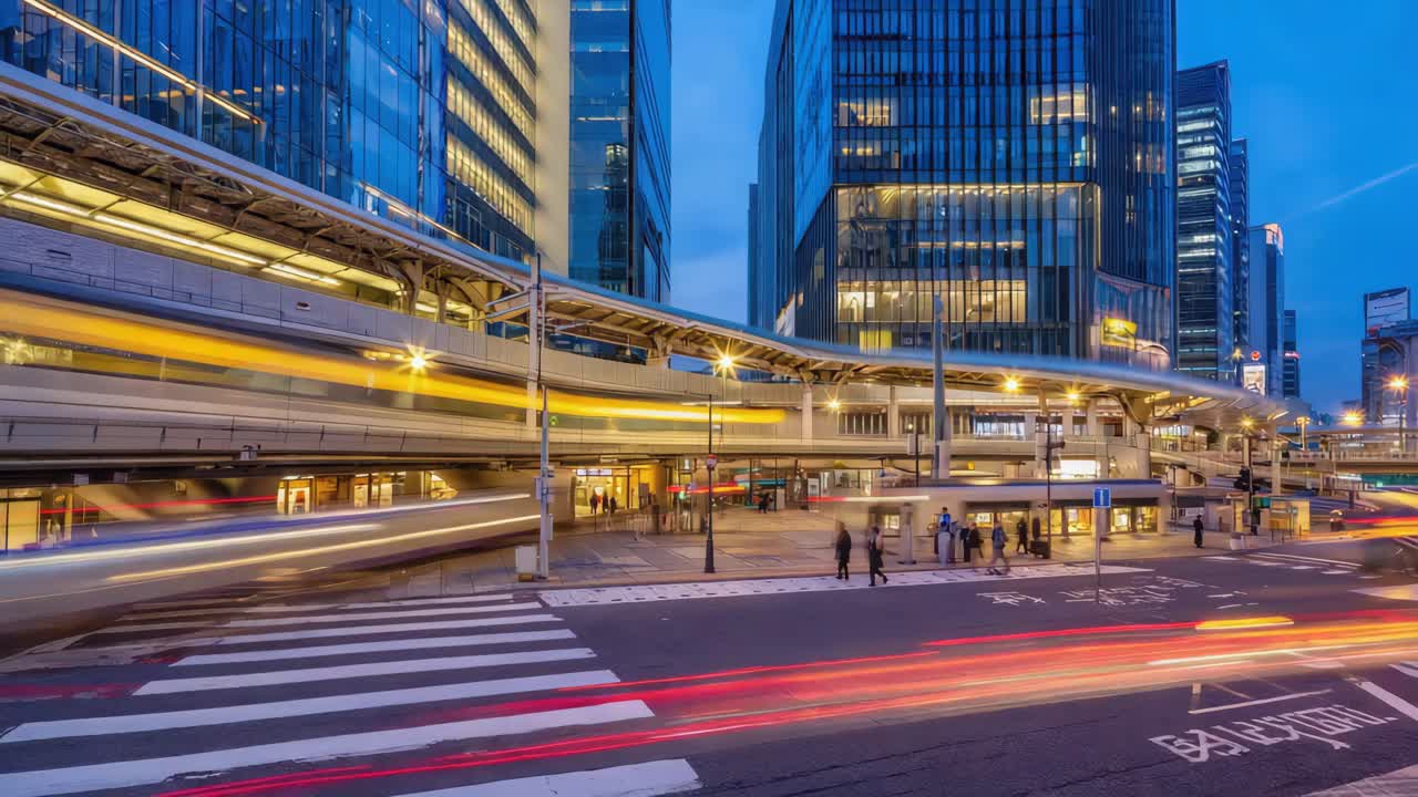 Modern Cityscape at Dusk with Illuminated Buildings and Pedestrian Walkway