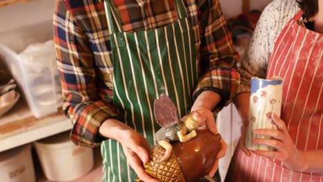 Potters-looking-at-pottery