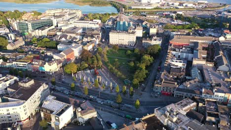the irish train station in the city of galway, this shot that comes from a drone slowly rotates left with the train station and the tracks directly in front