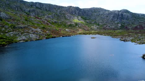 Rio-tera-canyon-and-dam-lake-at-base-of-tall-cliff-mountains-in-zamora-spain