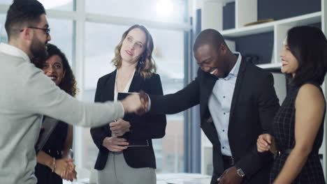 a group of businesspeople shaking hands
