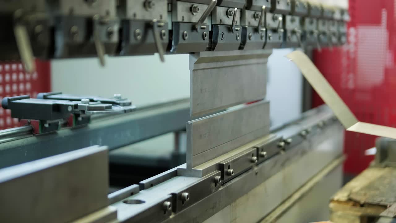 Operator working cut and bending metal sheet by high precision metal sheet bending machine, cnc control metal sheet bending machine in factory